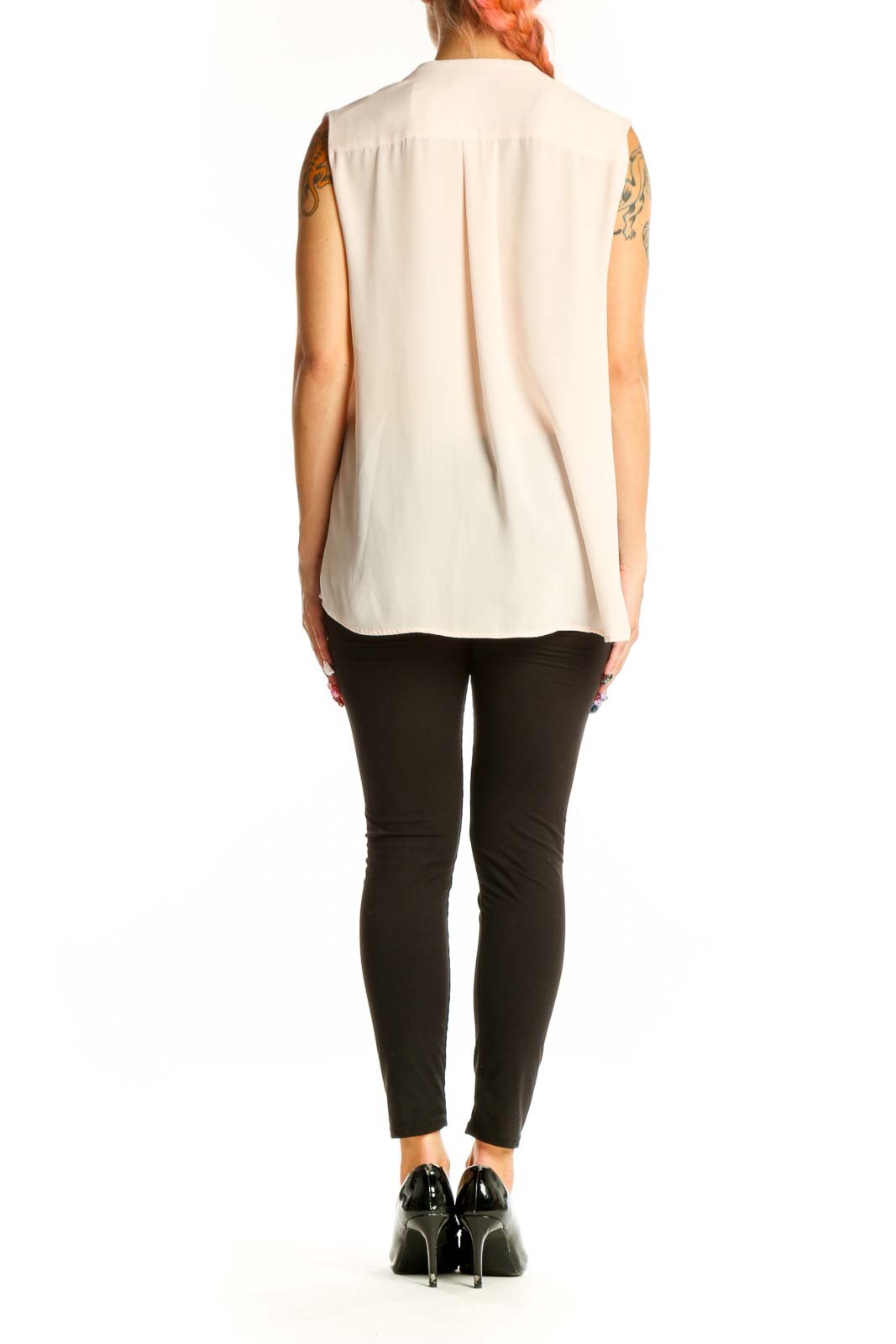 Side view of Mango blush sleeveless V-neck flowy blouse on model