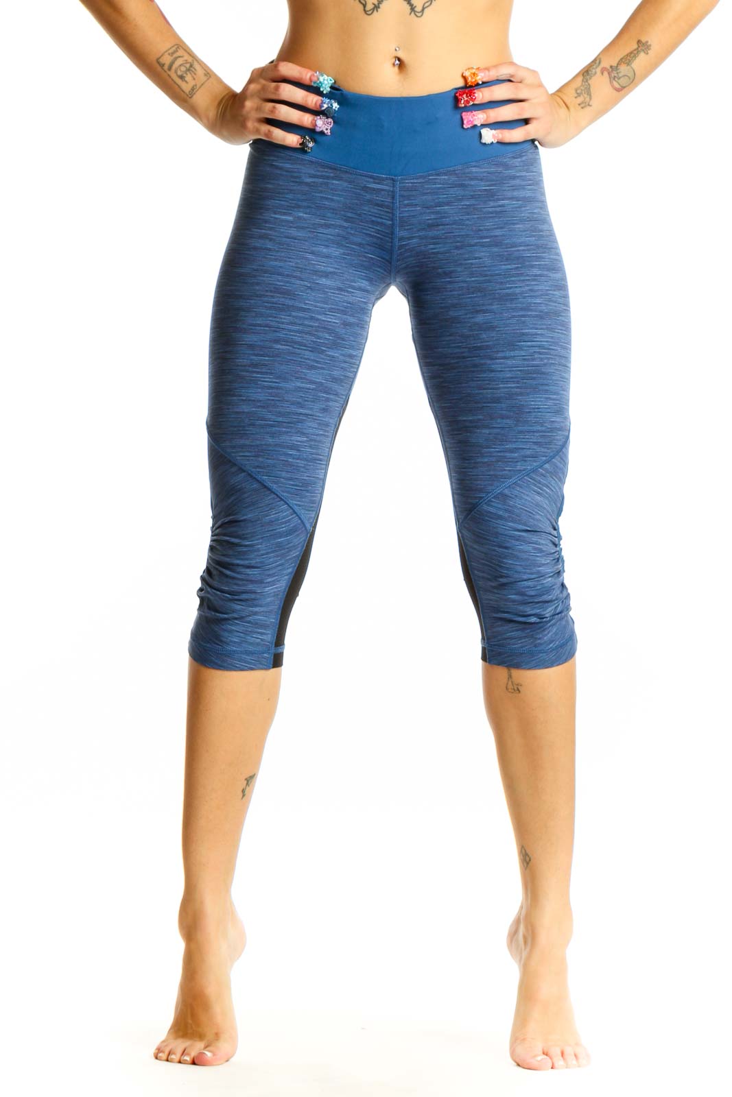Front view of blue heathered Lululemon capri leggings with high-rise waistband