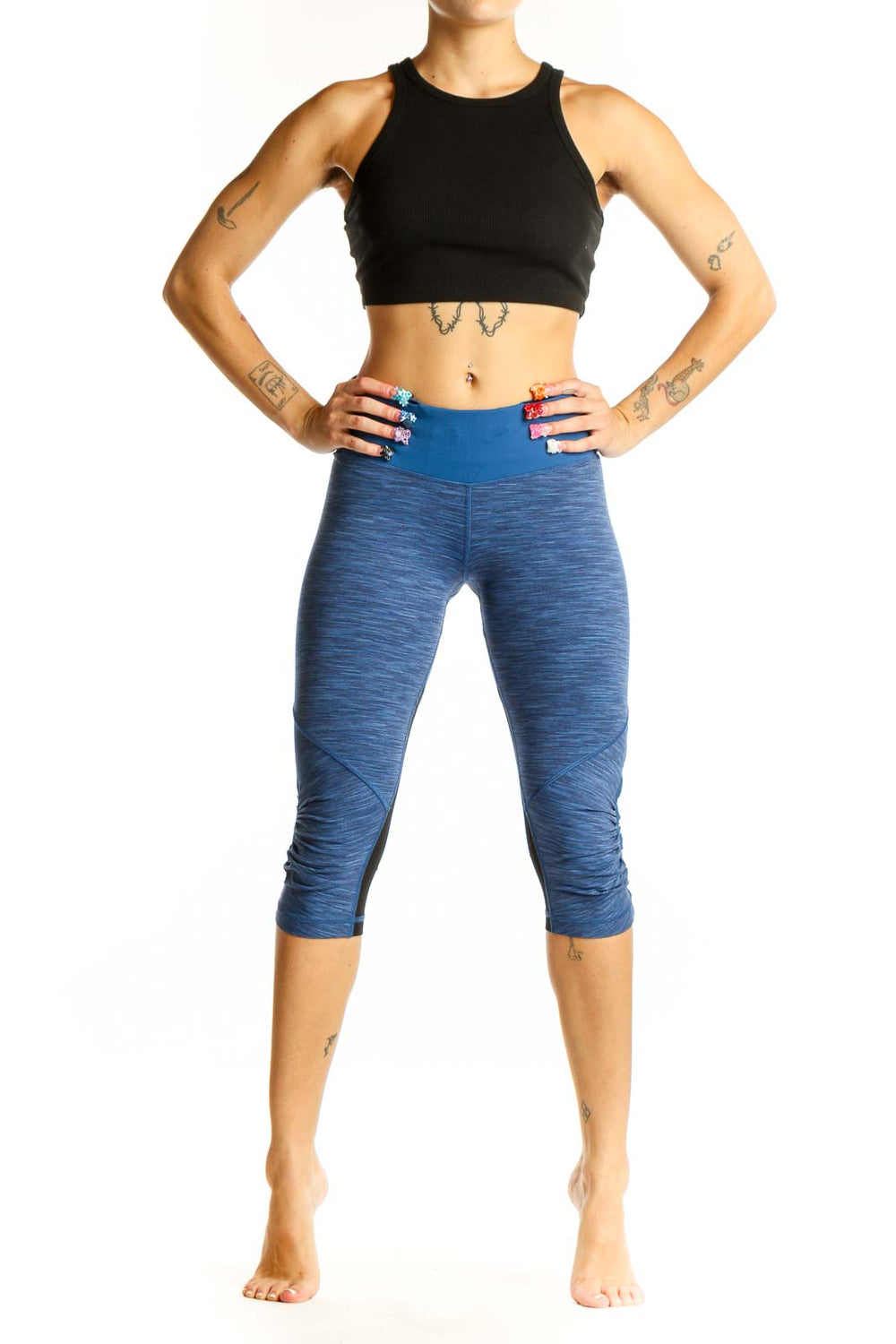 Front view of blue heathered Lululemon capri leggings with high-rise waistband