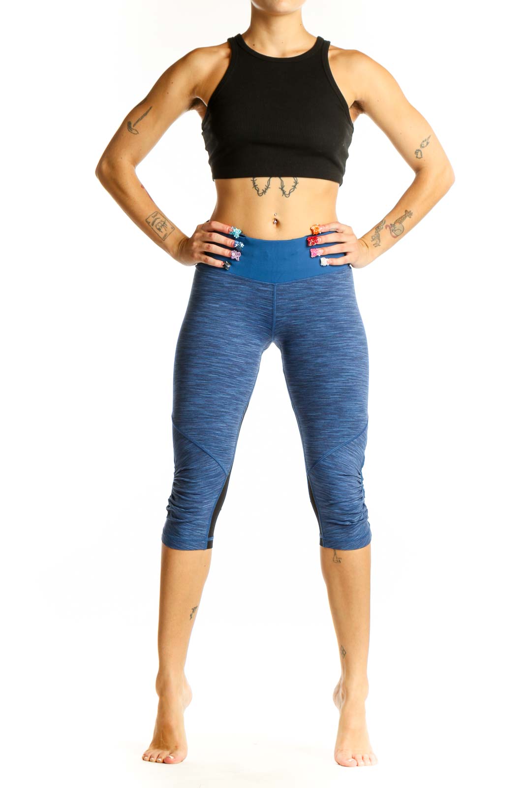 Front view of blue heathered Lululemon capri leggings with high-rise waistband