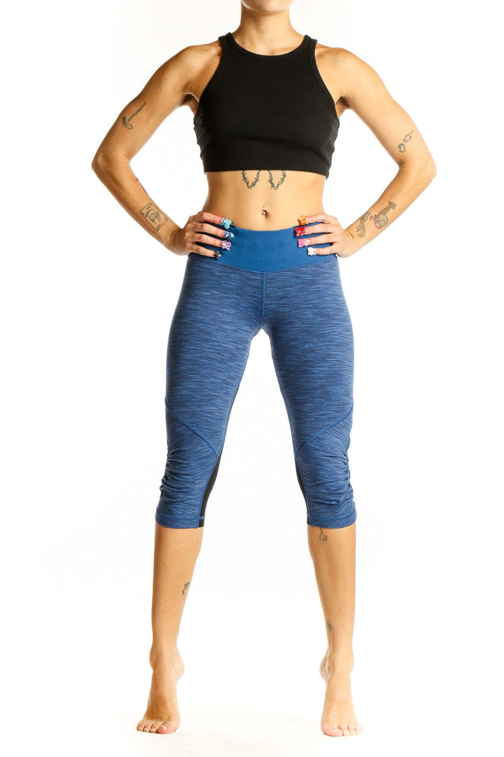 Front view of blue heathered Lululemon capri leggings with high-rise waistband
