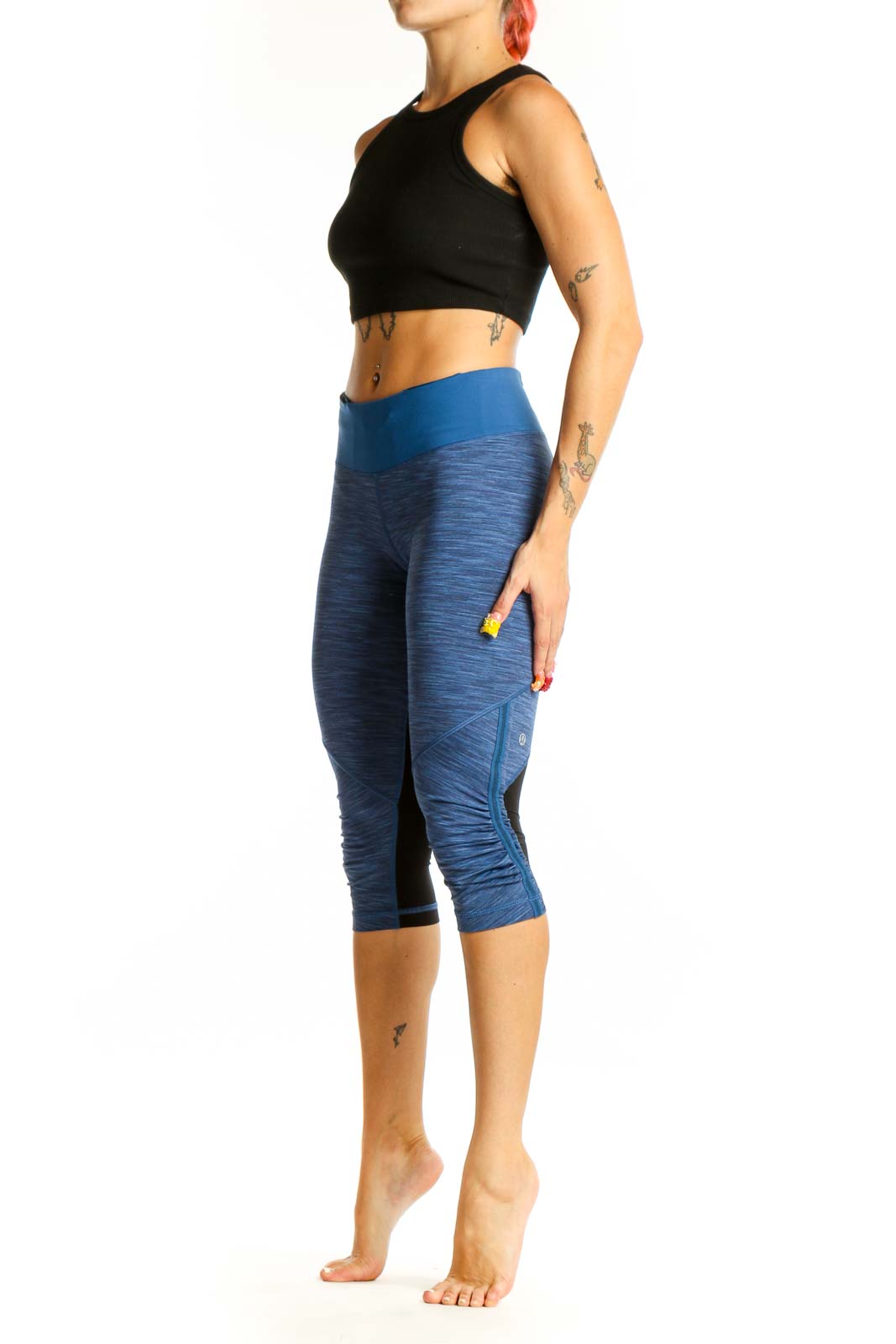 Front view of blue heathered Lululemon capri leggings with high-rise waistband