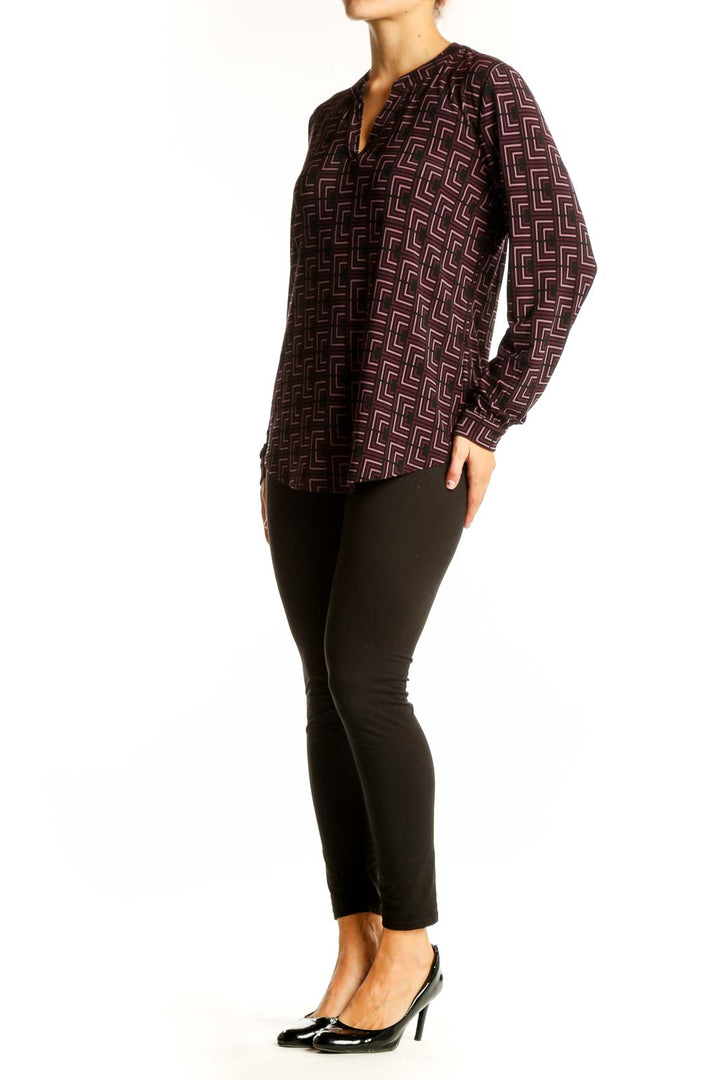 Front view of Anne Klein burgundy geometric print long sleeve blouse