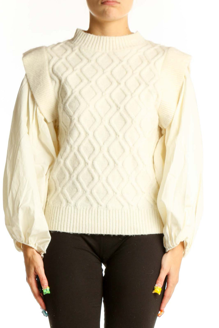 Front view of cream cable knit sweater with puff sleeves by a loves a