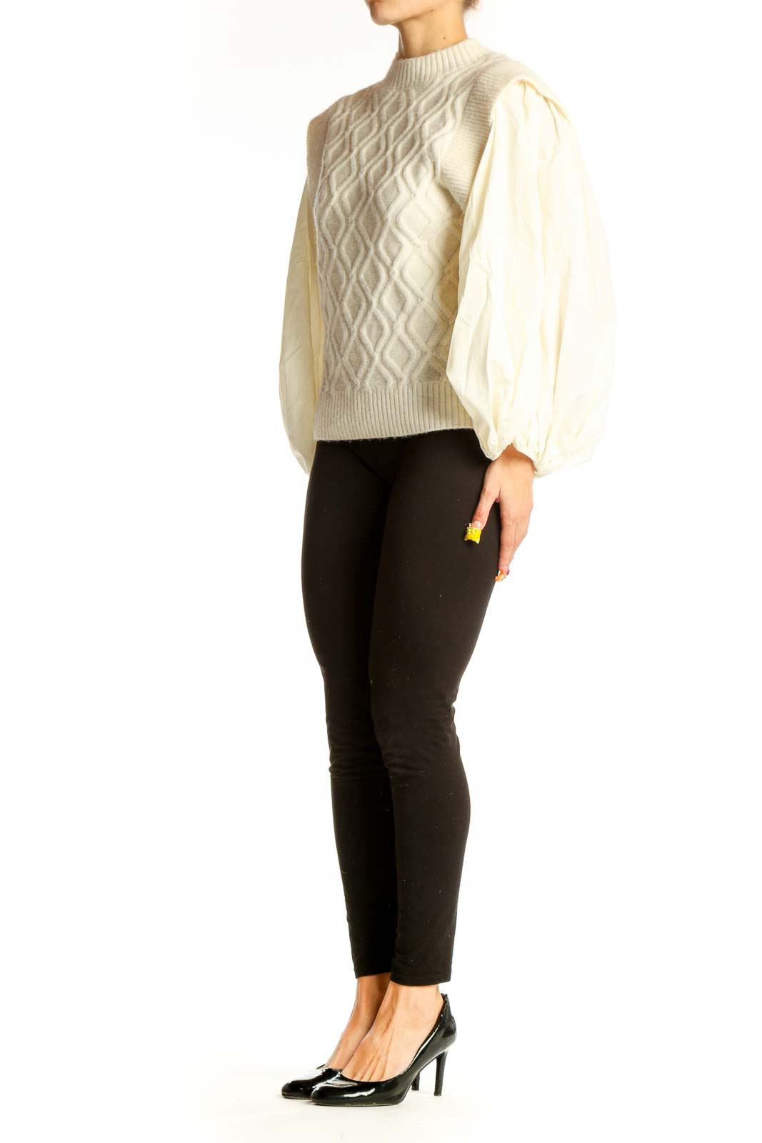Front view of cream cable knit sweater with puff sleeves by a loves a