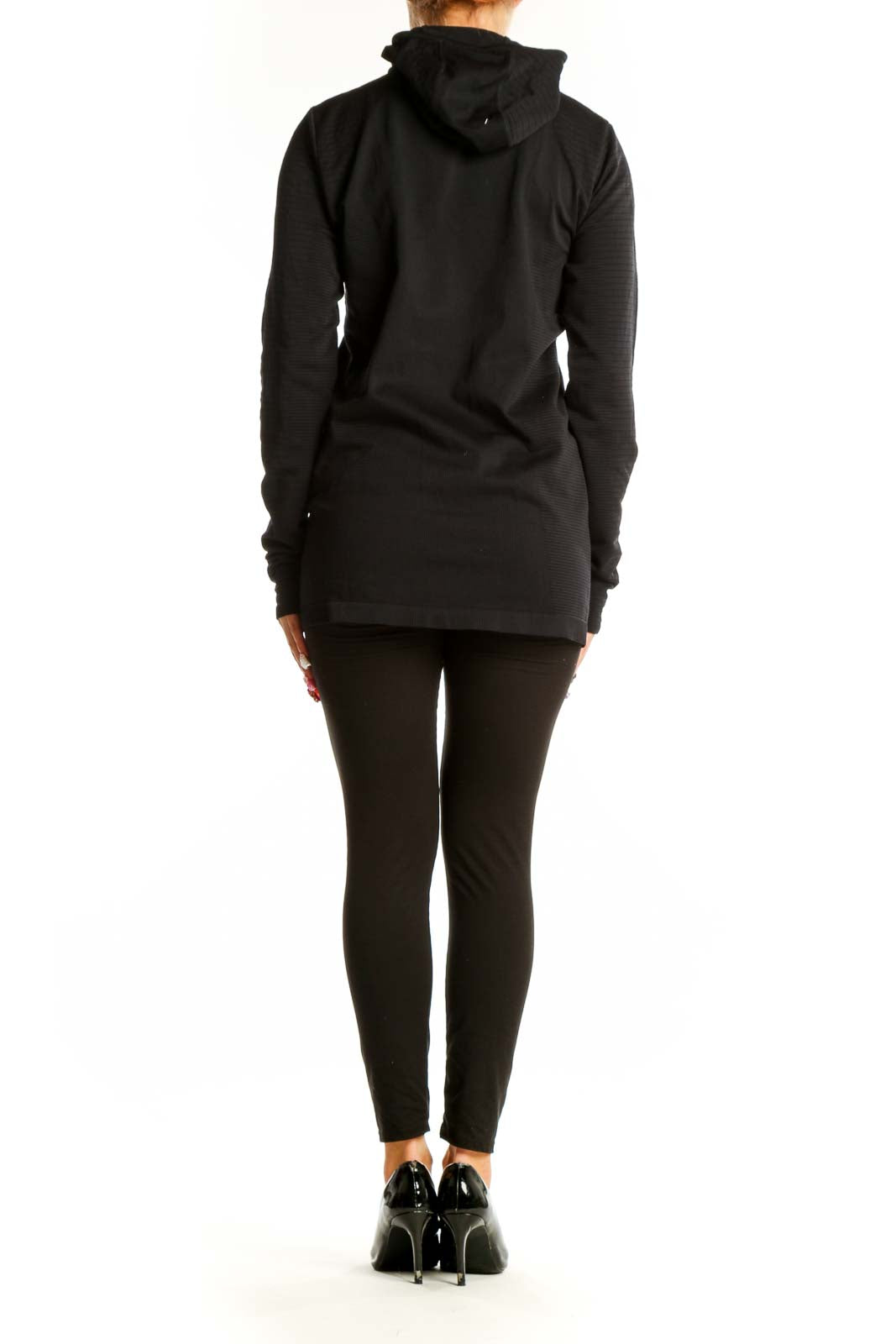 Back view of black Athleta activewear top showing fitted silhouette