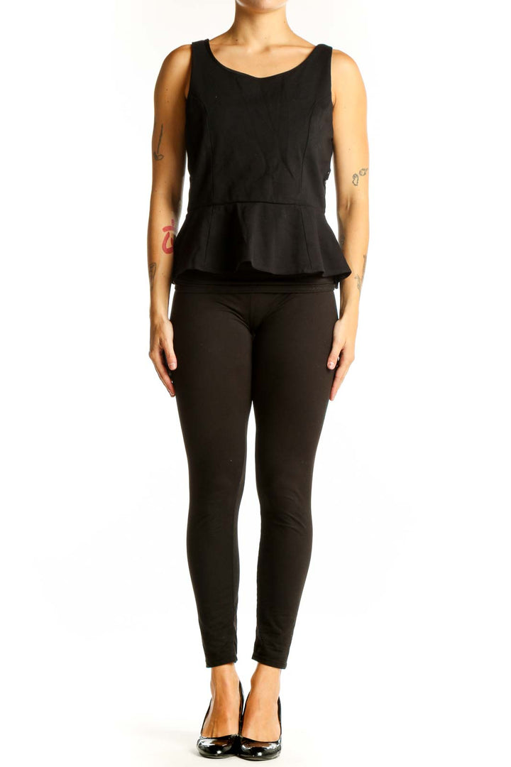 Front view of black sleeveless peplum top by Express