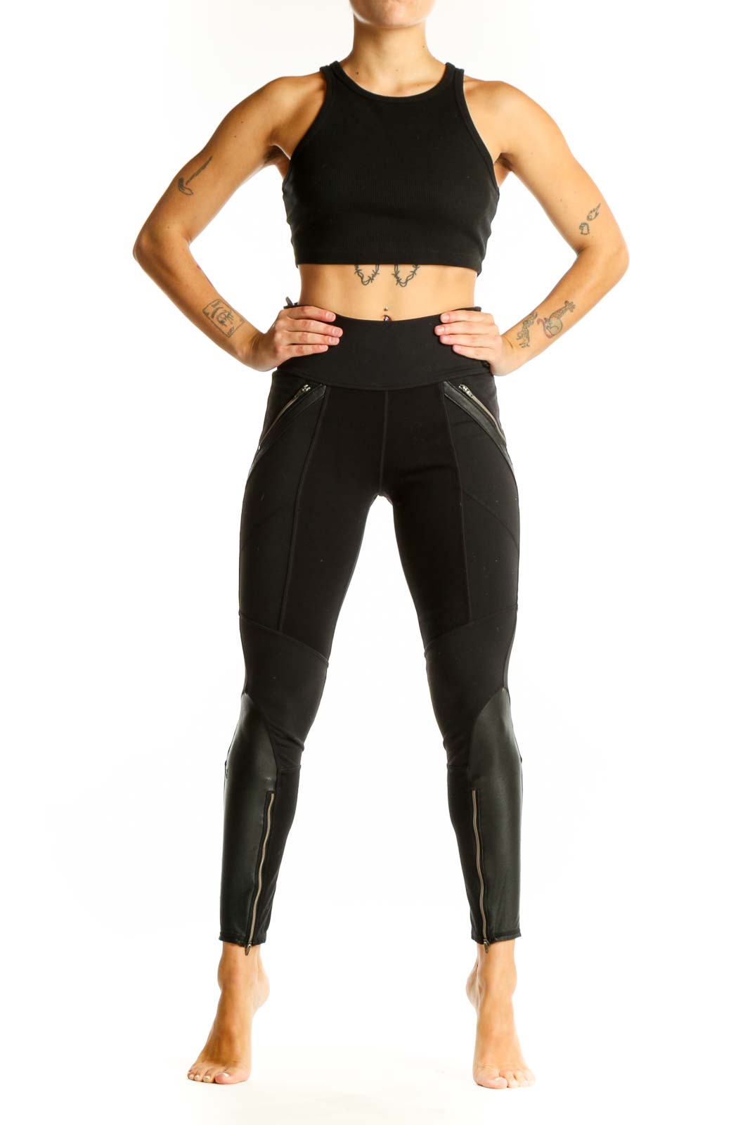 Front view of black Athleta athletic leggings with zipper pockets