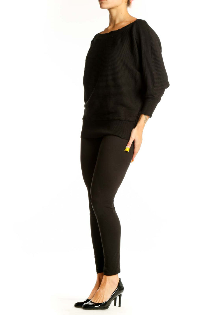 Front view of Dex black ribbed sweater with batwing sleeves