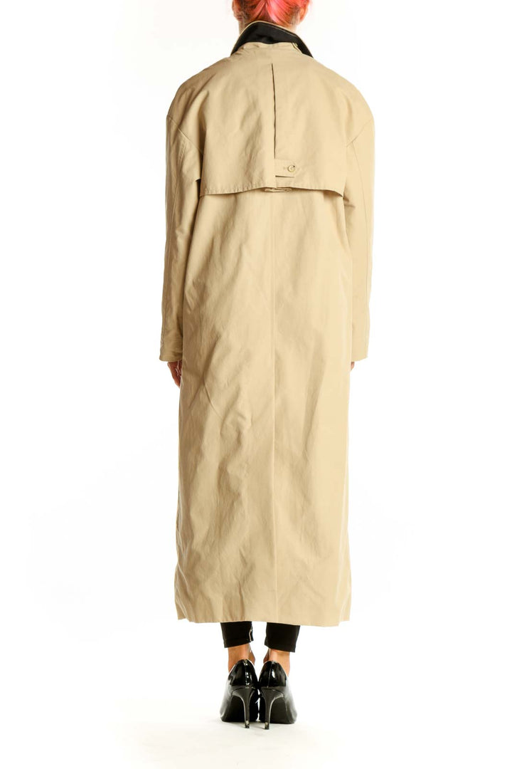 Side view of Mango beige long button-up coat