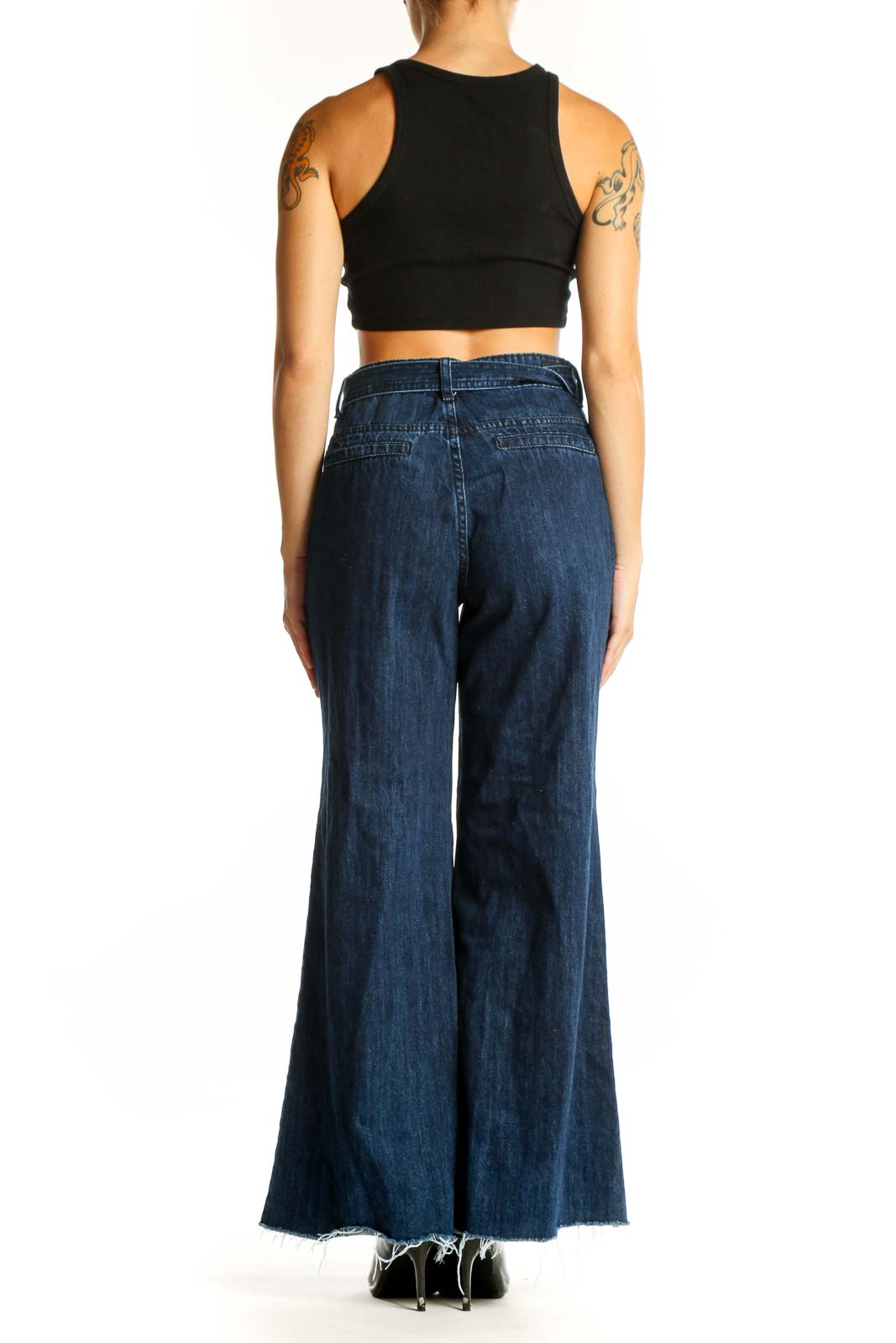 Side view of model wearing Flamingo dark blue wide-leg denim jeans