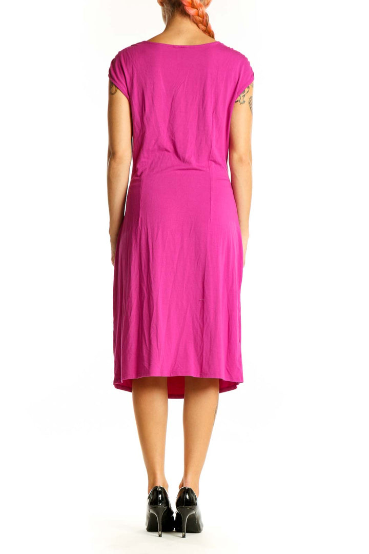 Side view of fuchsia Ann Taylor wrap-style midi dress showing ruching detail