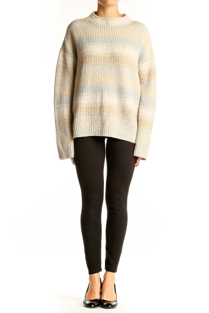 Front view of Gap beige striped oversized knit sweater with ribbed texture