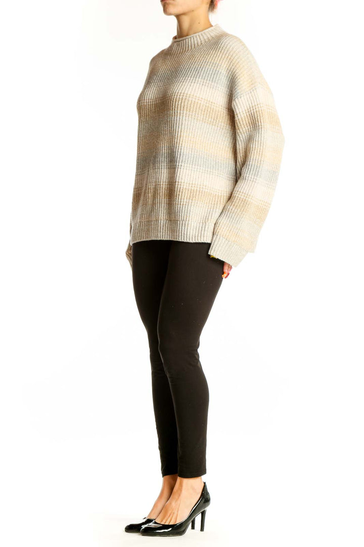Front view of Gap beige striped oversized knit sweater with ribbed texture