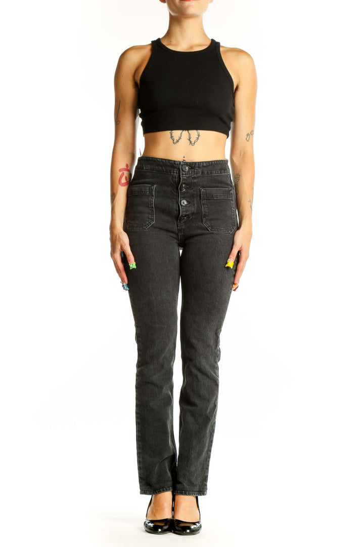 Front view of Reformation black straight leg jeans with button-fly and patch pockets