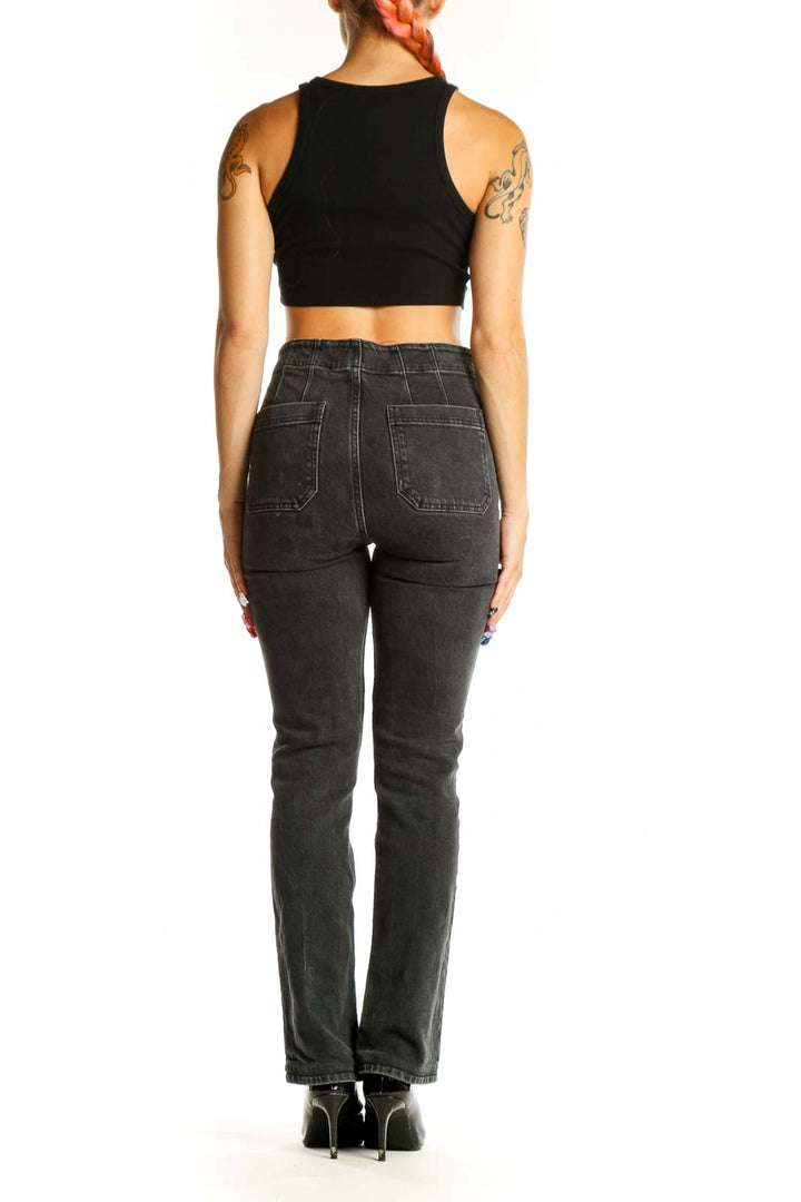 Back view of Reformation black straight leg jeans on model
