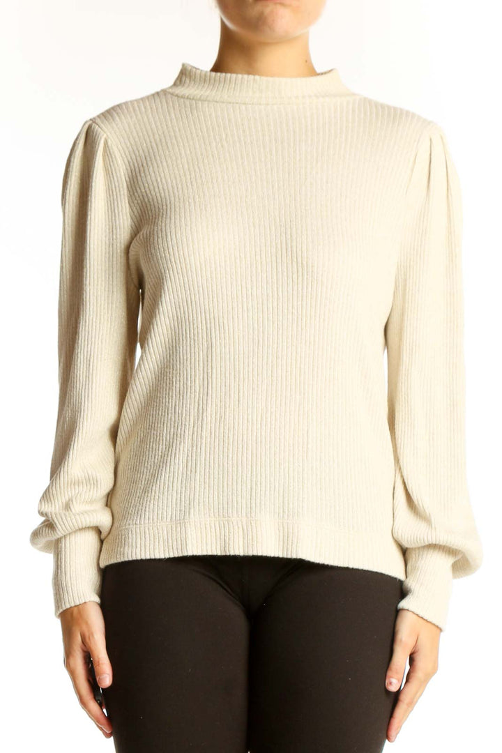 Front view of LOFT cream ribbed mock neck sweater with puff sleeves
