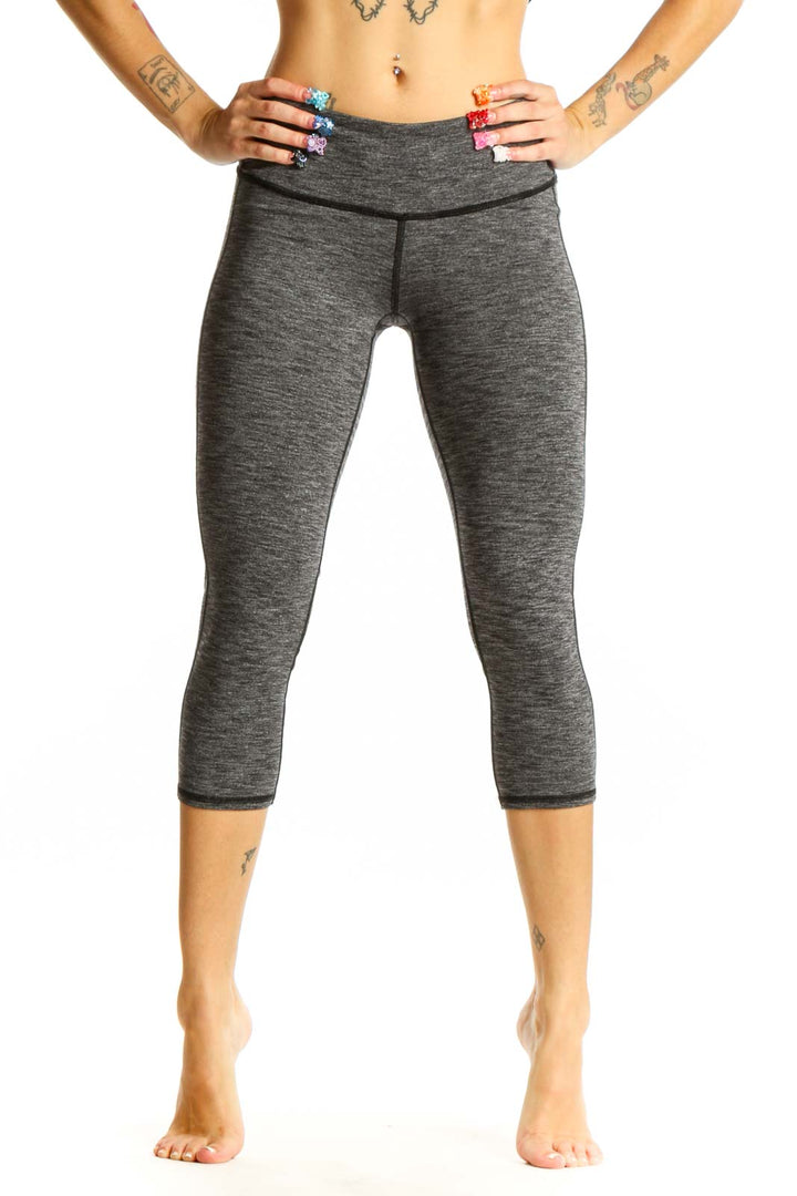 Front view of gray heathered Athleta capri leggings on model