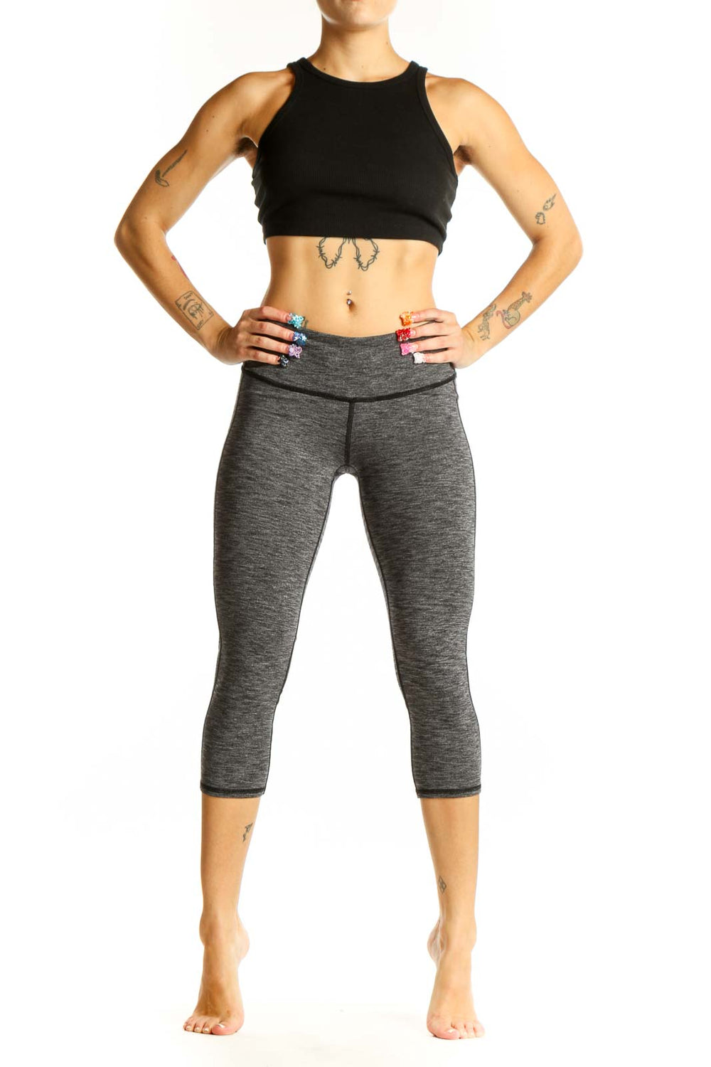 Front view of gray heathered Athleta capri leggings on model