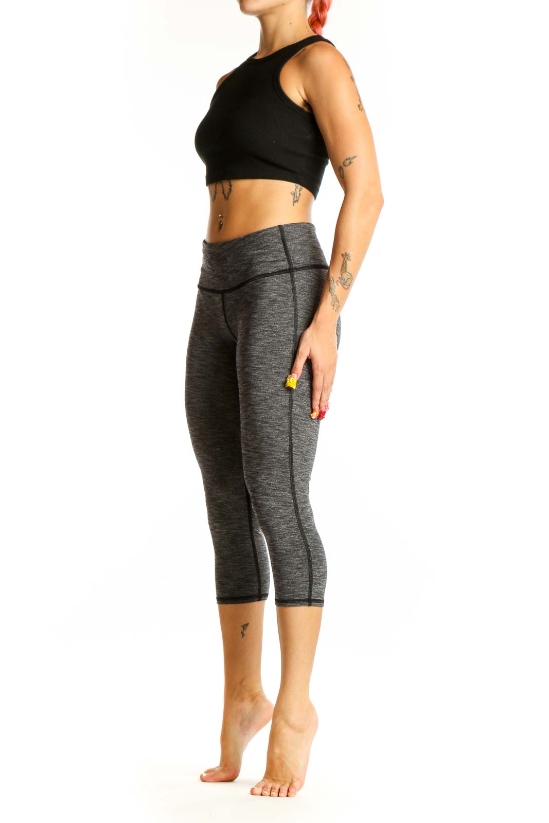 Front view of gray heathered Athleta capri leggings on model