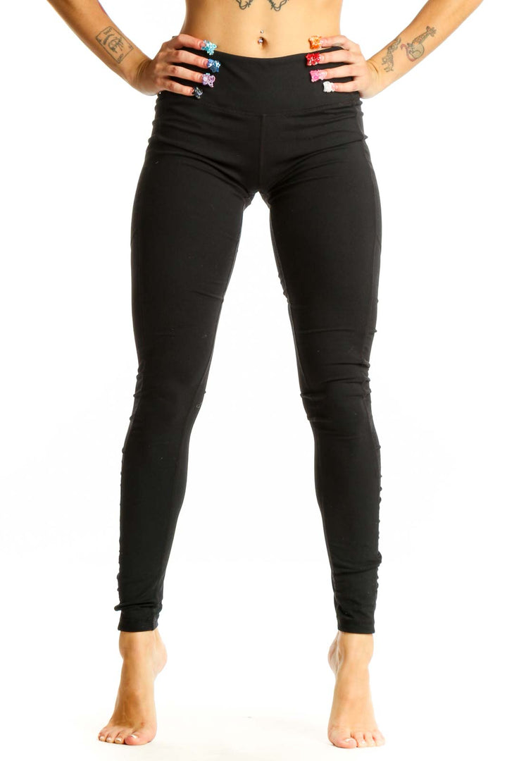 Front view of black Lululemon high-waisted performance leggings