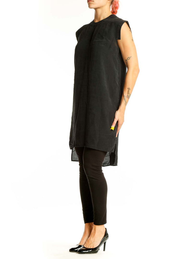 Front view of All Saints black silk sleeveless tunic with high neckline