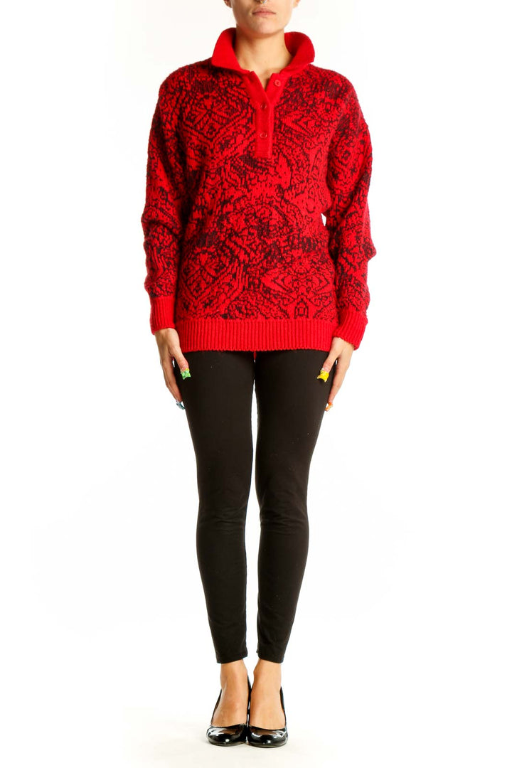 Front view of red M/a/s/e/r knit sweater with black geometric pattern