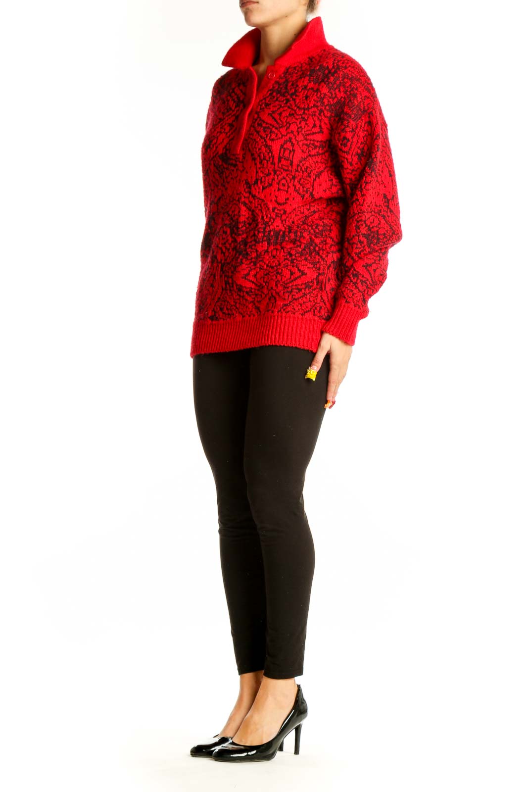 Front view of red M/a/s/e/r knit sweater with black geometric pattern
