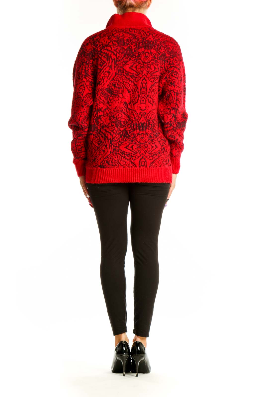 Side view of model wearing red M/a/s/e/r geometric pattern sweater with black pants