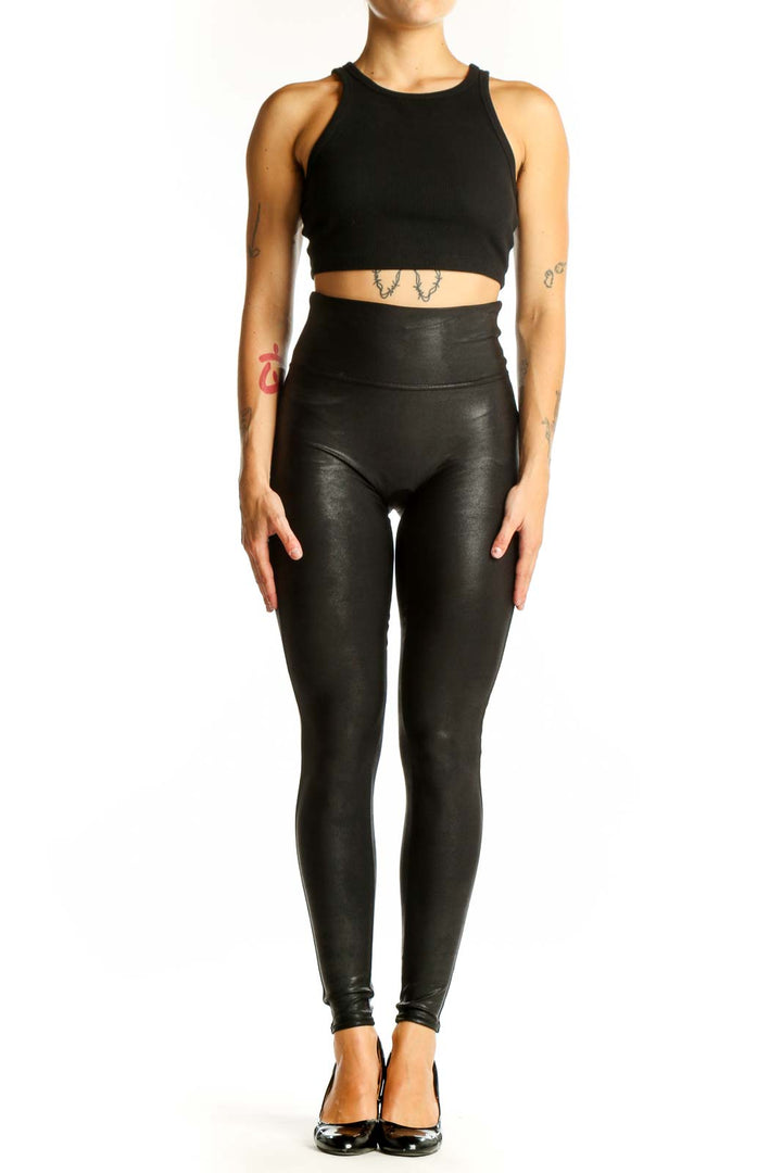Front view of Spanx black high-waisted faux leather leggings