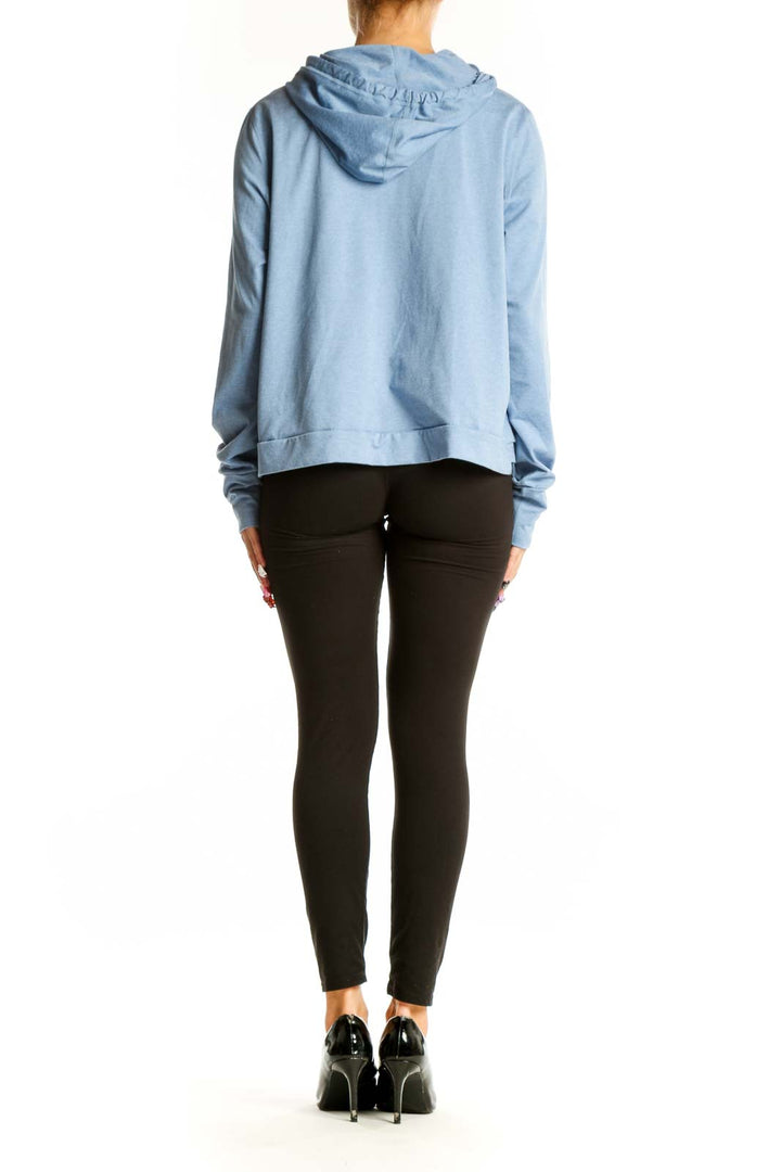 Side view of light blue Vuori recycled polyester hoodie on model