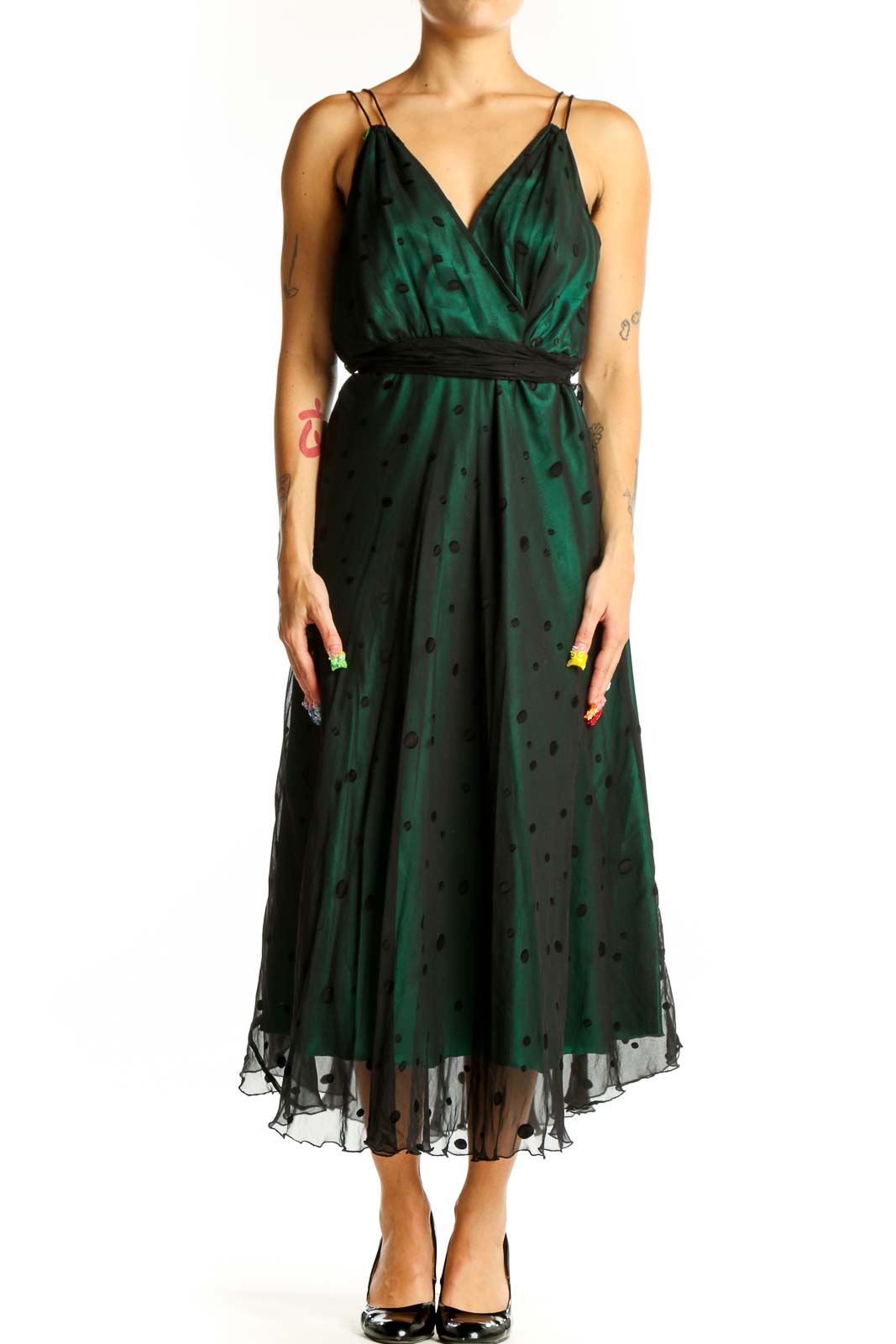 Front view of emerald green polka dot midi dress with wrap-style bodice and black waistband
