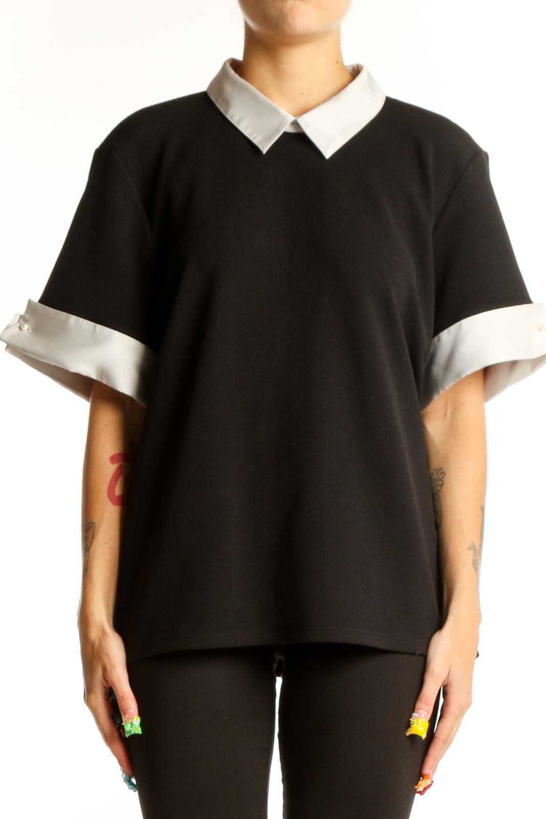 Front view of Karl Lagerfeld Paris black blouse with white collar and cuffs