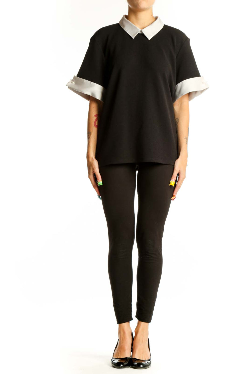 Front view of Karl Lagerfeld Paris black blouse with white collar and cuffs