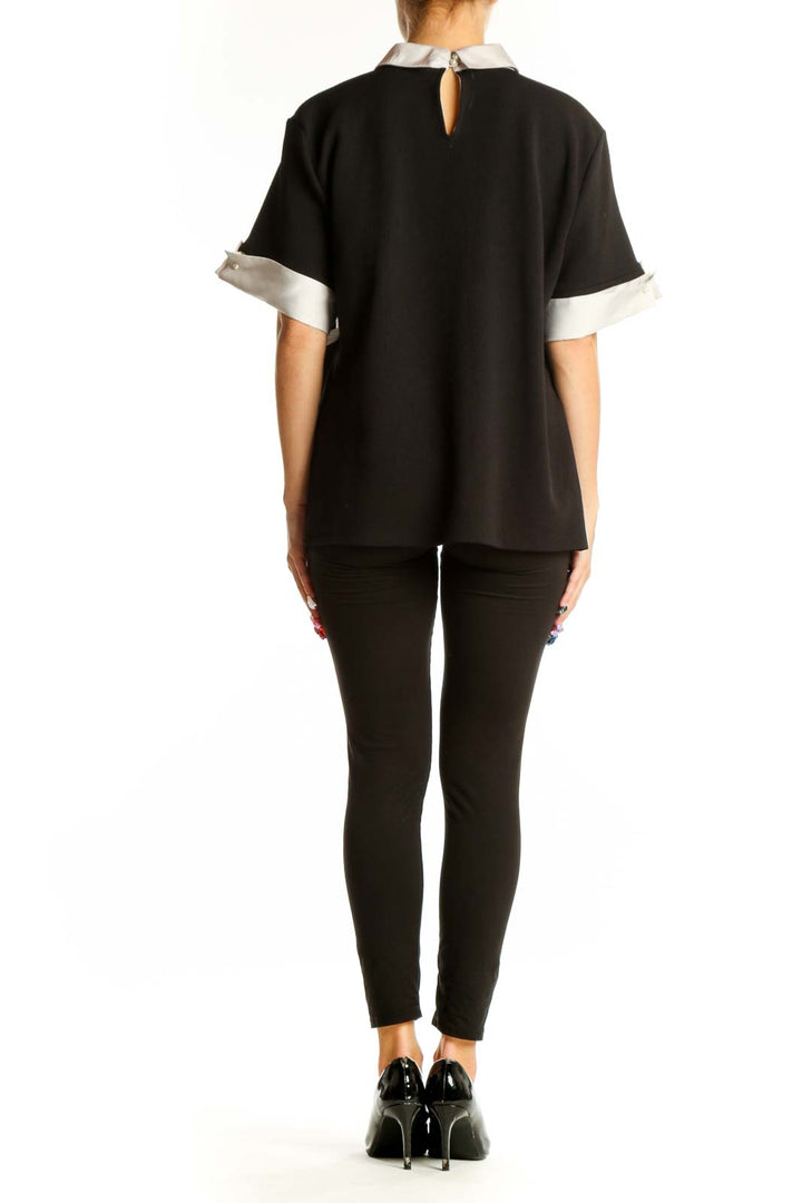 Back view of Karl Lagerfeld Paris black blouse showing relaxed fit