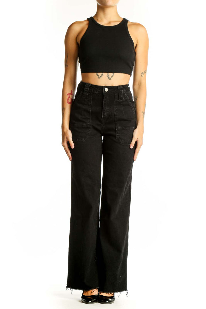 Front view of black wide-leg denim jeans with patch pockets