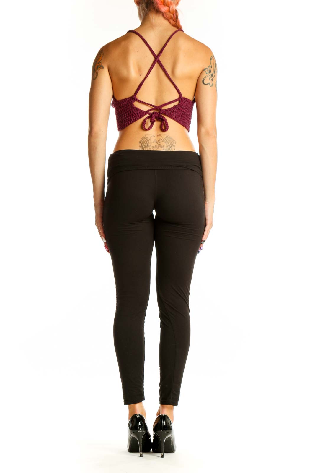 Side view of burgundy crochet crop top showing fitted silhouette
