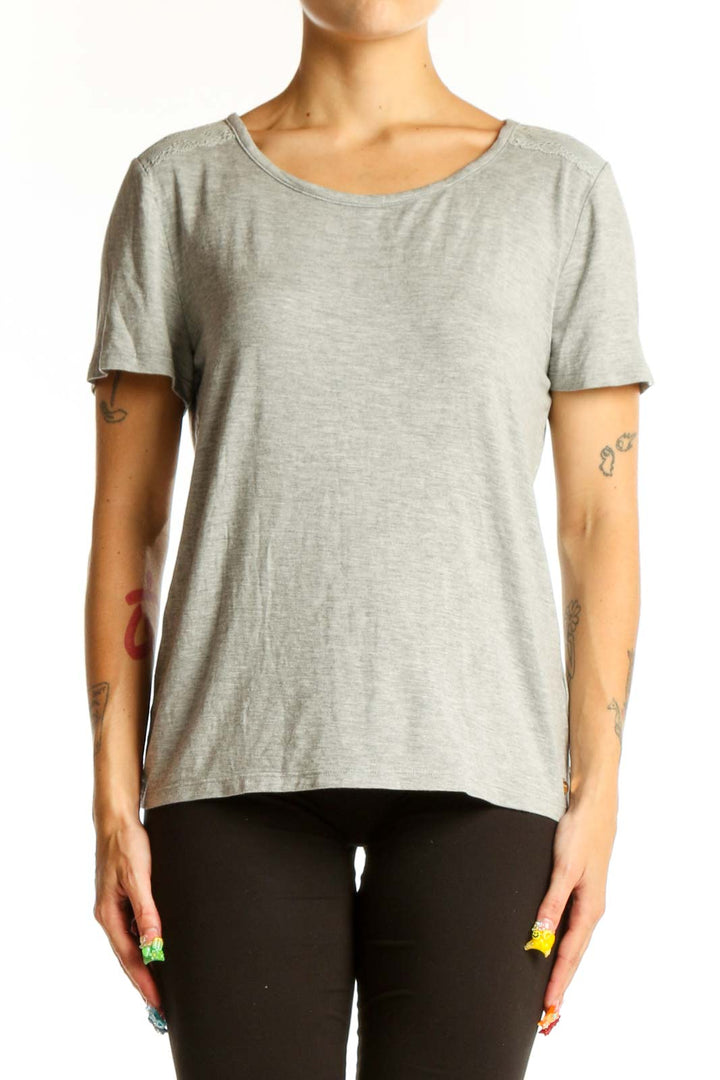 Front view of gray Juicy Couture short sleeve top on model
