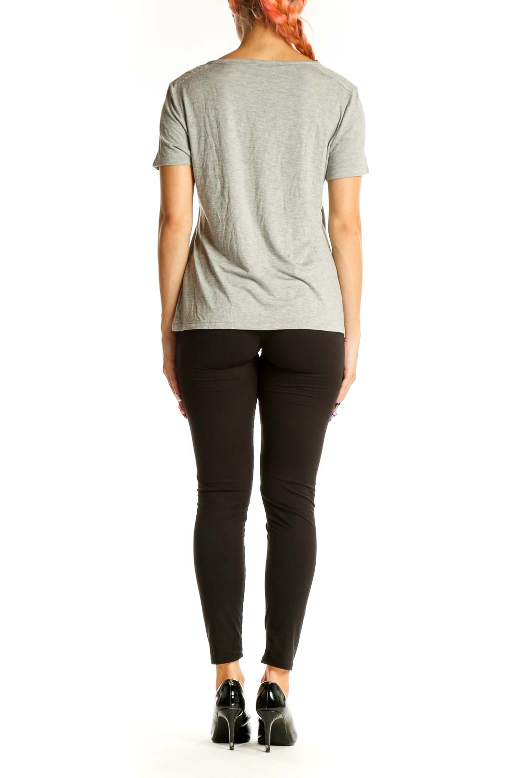 Side view of gray Juicy Couture short sleeve top on model with black pants
