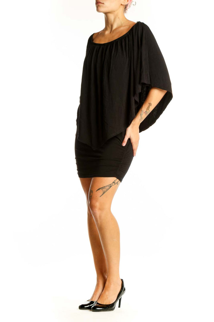 Front view of black off-shoulder mini dress with draped overlay from Boston Proper