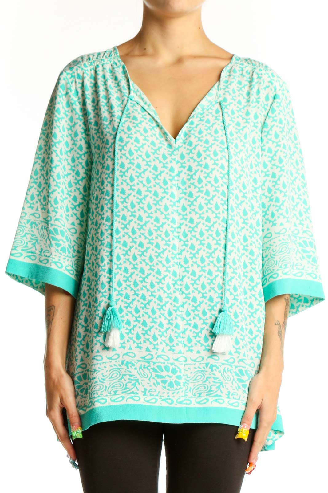 Front view of Chaus mint floral print tunic top with V-neck and tassel ties