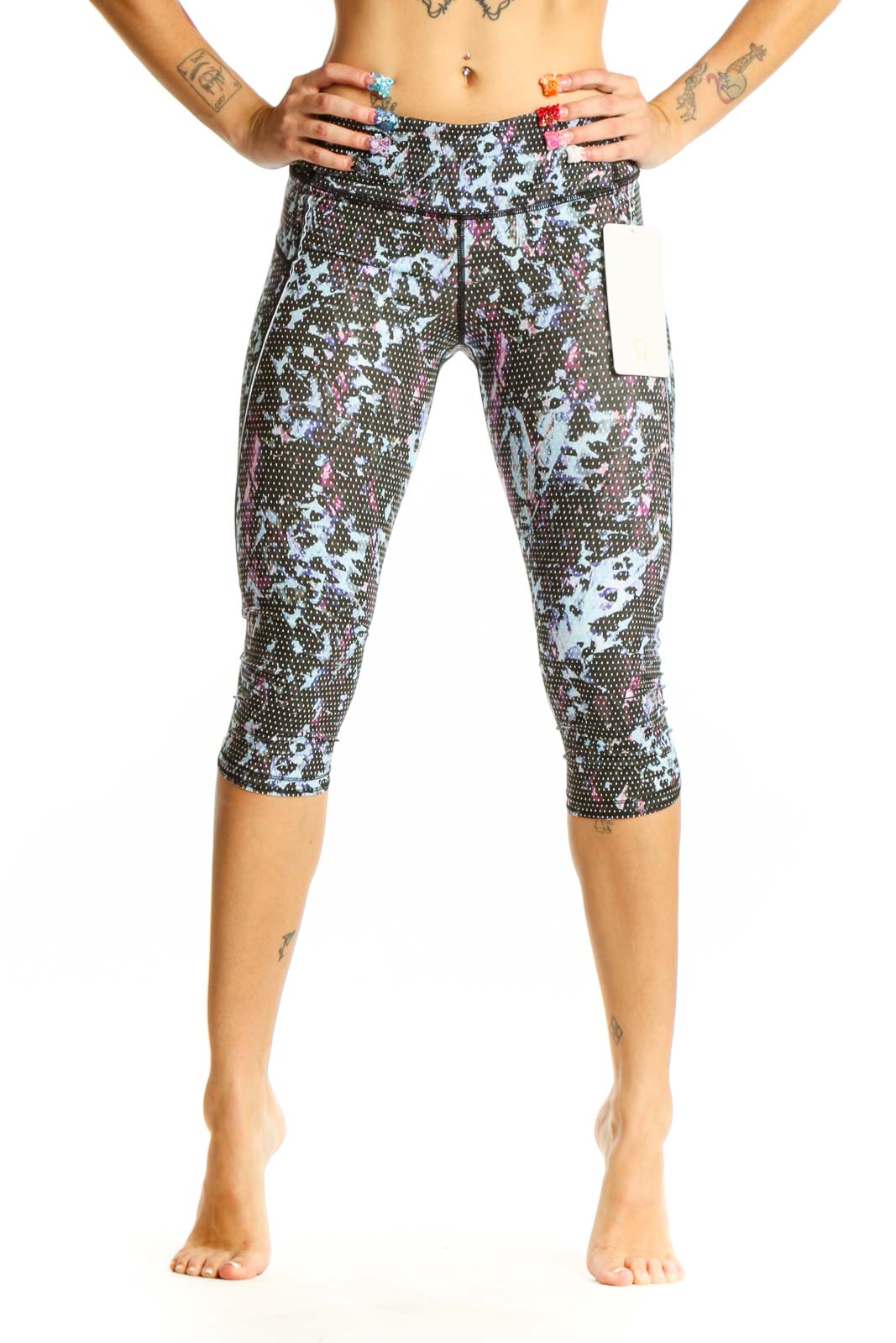 Front view of Lululemon blue floral print capri leggings on model