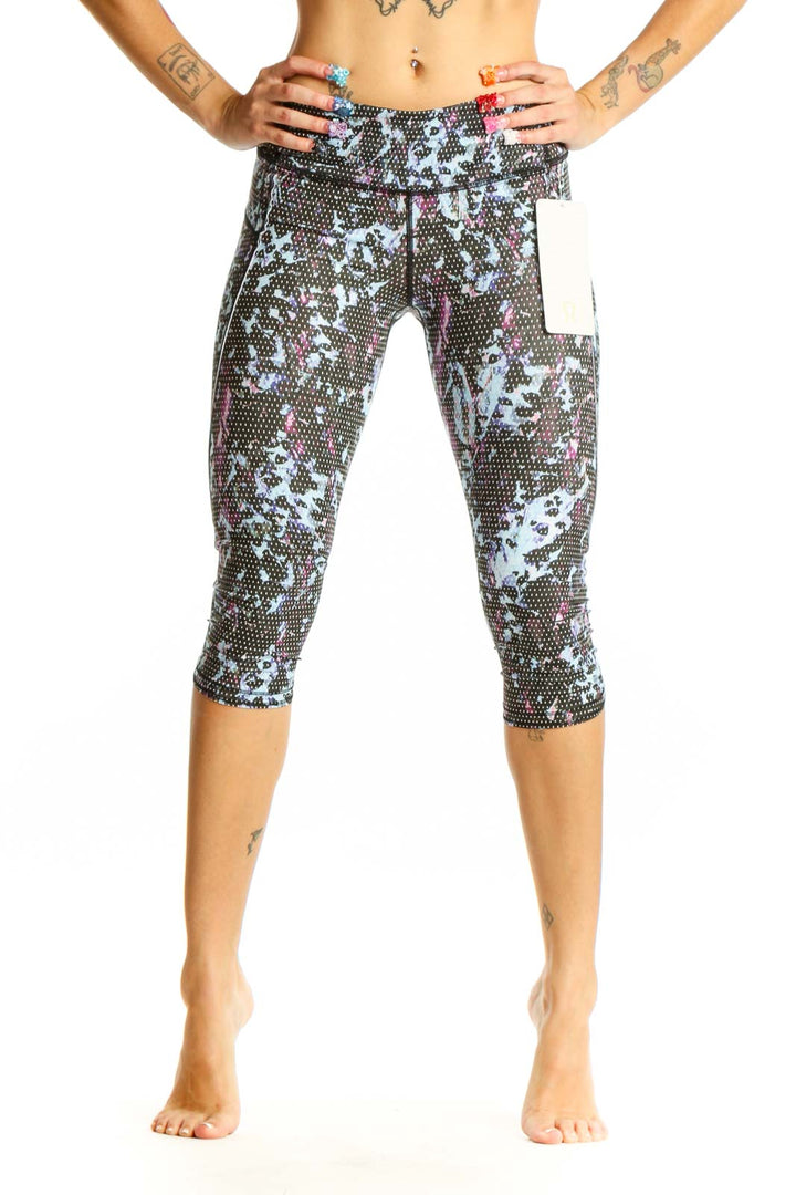 Front view of Lululemon blue floral print capri leggings on model
