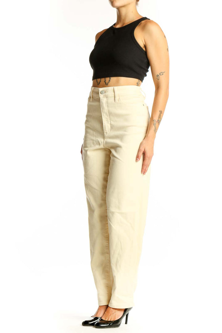 Front view of Athleta cream high-waisted straight leg jeans