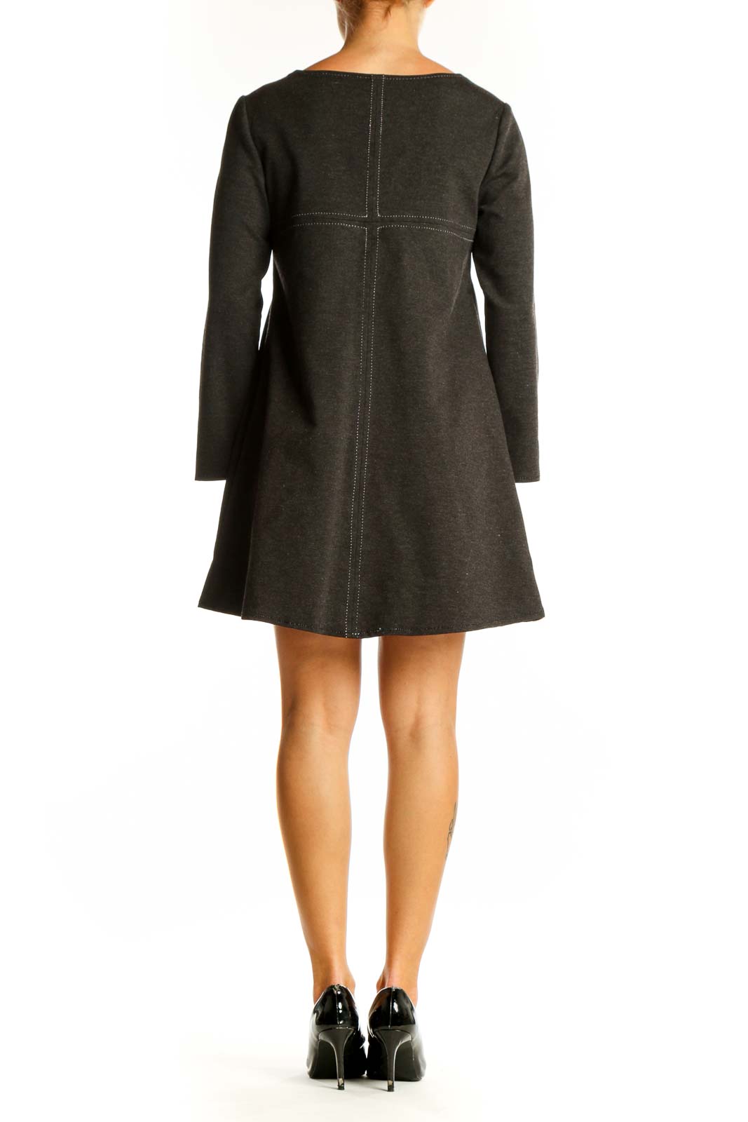 Side view of Studio M charcoal long sleeve A-line mini dress on model