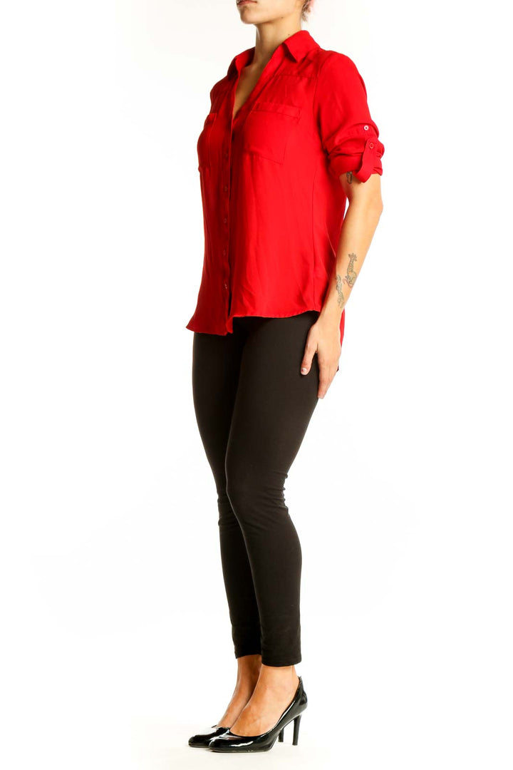 Front view of red Express polyester button-down blouse