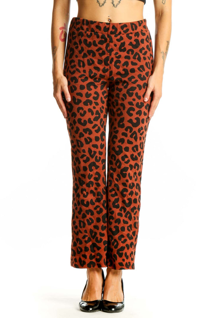 Front view of rust-colored leopard print straight leg pants