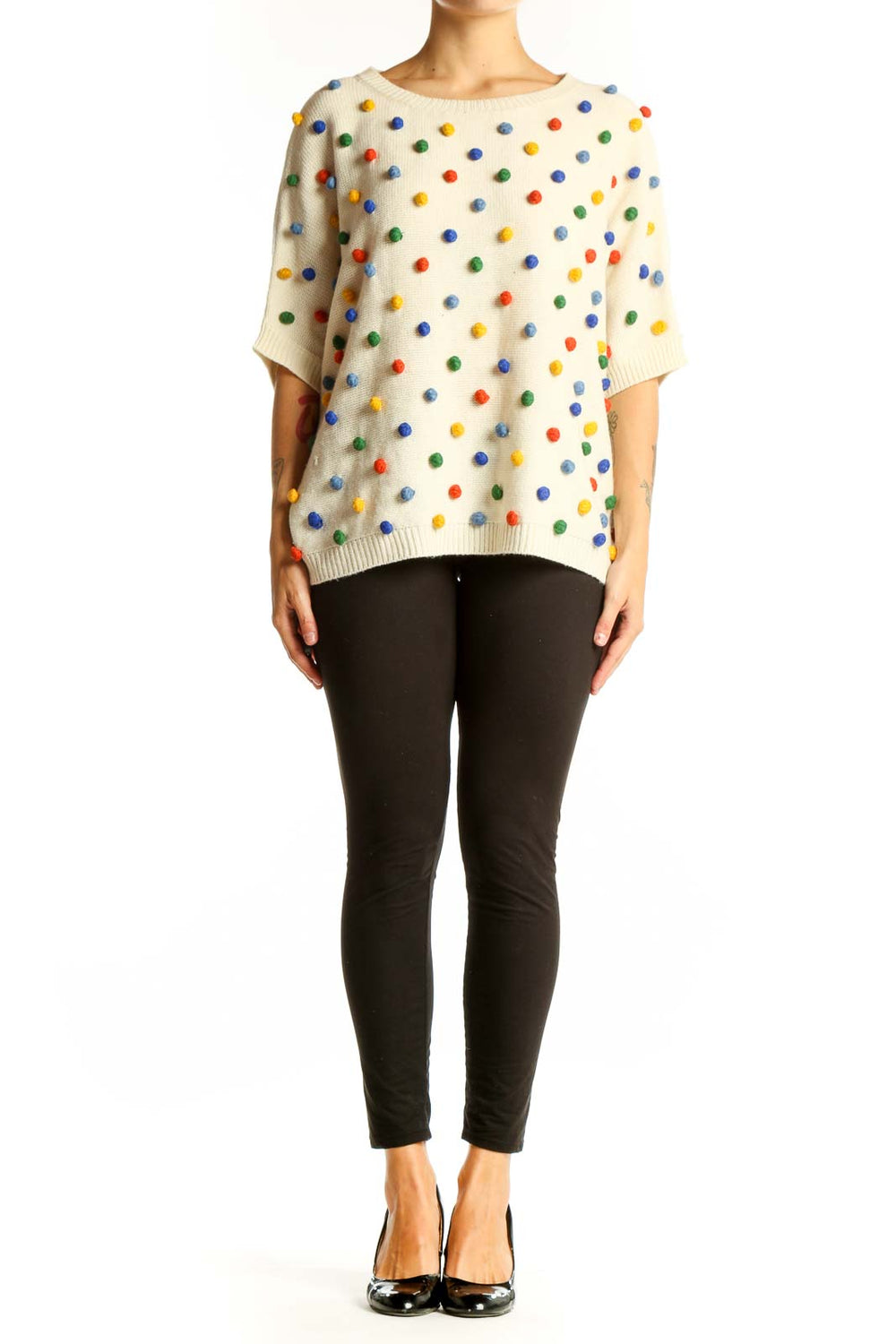 Front view of cream PepaLoves knit sweater with multicolored polka dots