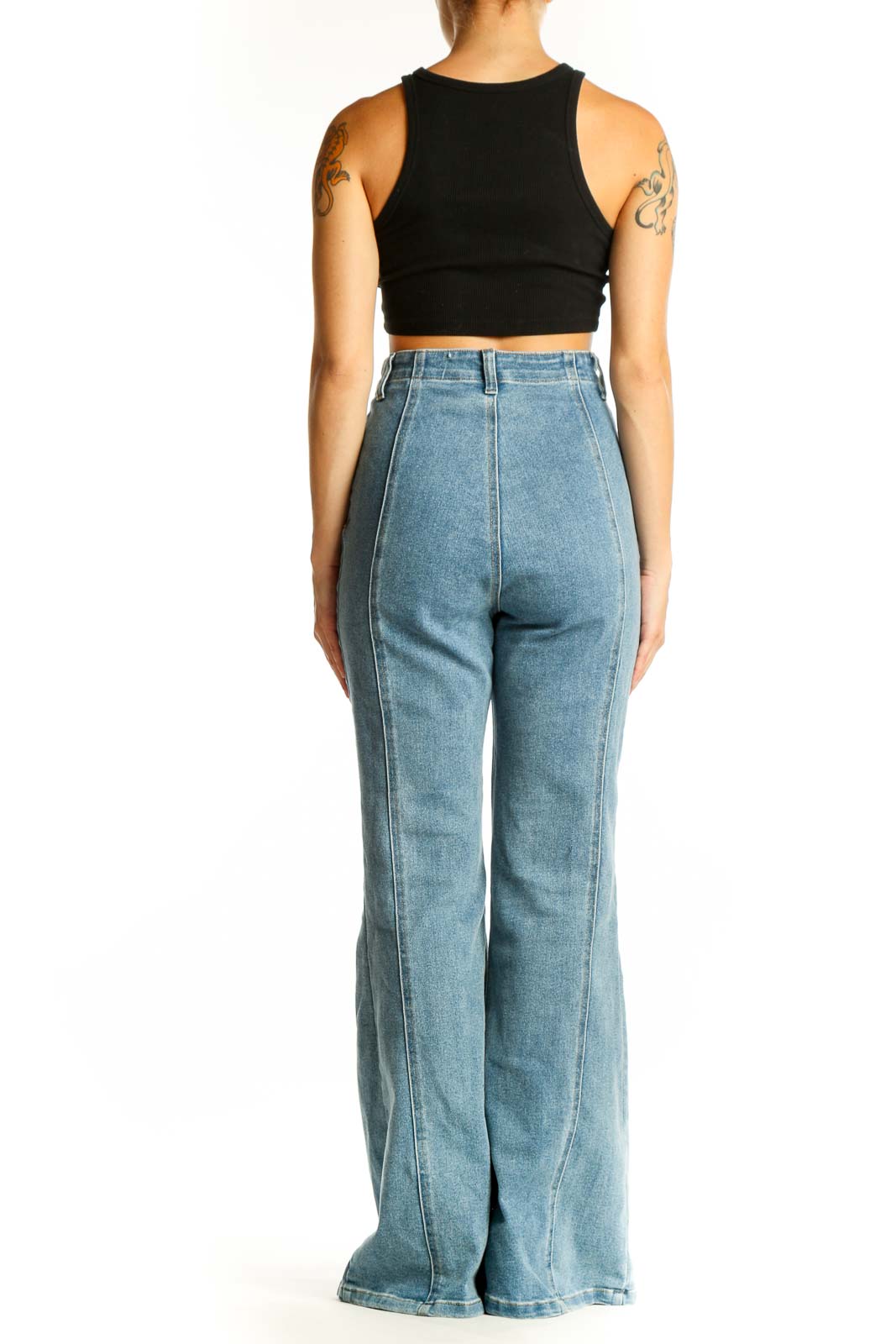 Side view of model wearing light blue high-waisted wide-leg jeans from Icone by Par Simons