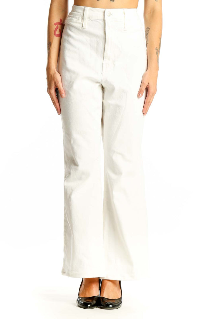 Front view of Madewell white high-waisted wide-leg jeans on model